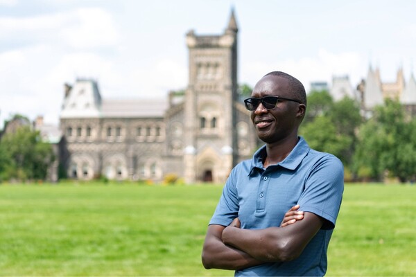 Man in sunglasses with U of T building in background