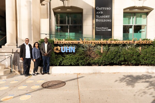 Kenyan fellows pose in front of Princess Margaret Cancer Centre