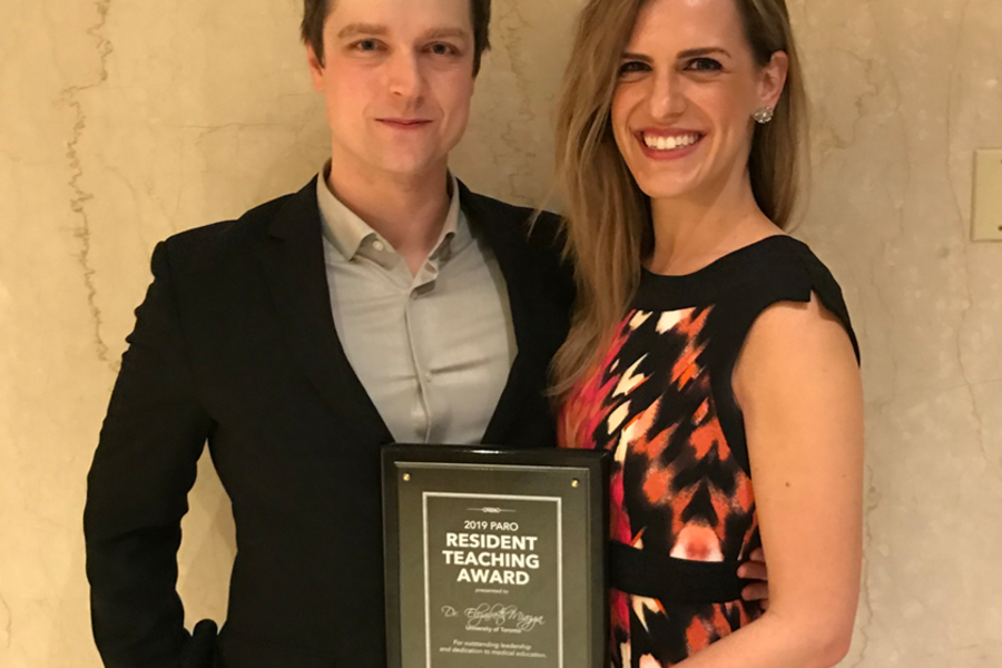 Dr. Elizabeth Miazga and partner with award