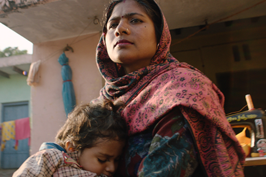 Screenshot from film of woman with child