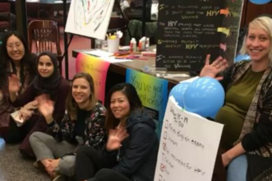 Residents waving in front of their HPV Vaccine Advocacy booth