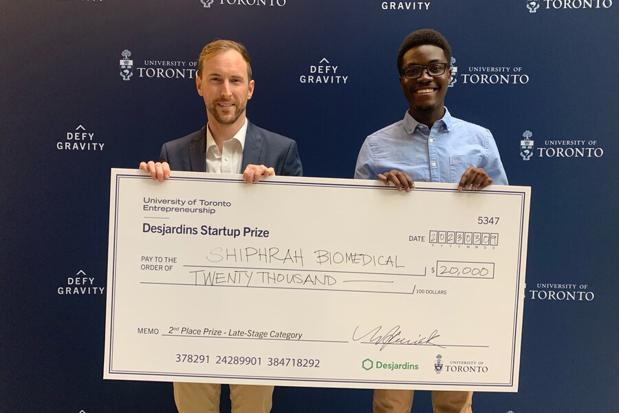 Dr. Allan Kember and his co-founder, Salim Kandedi, pose with their prize cheque