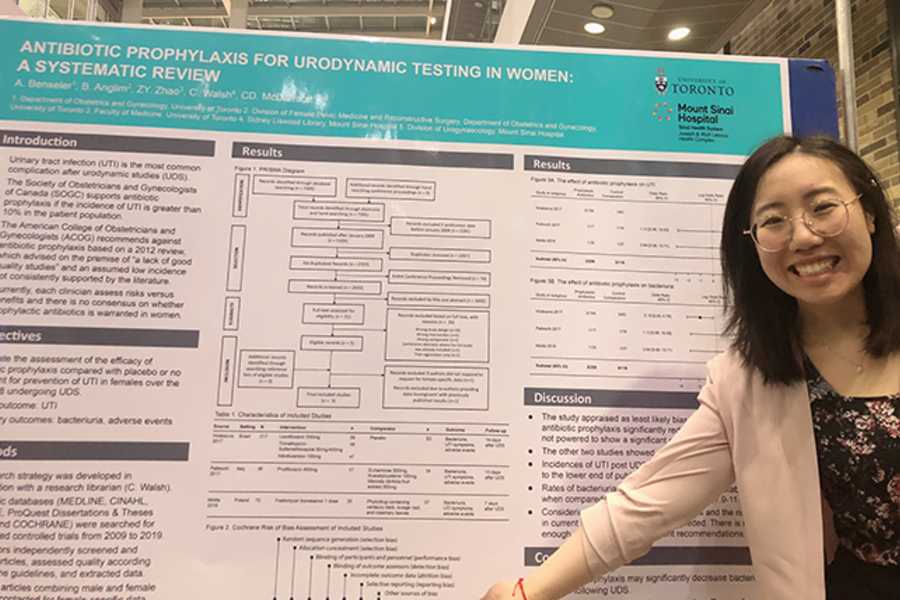 MD Student standing in front of their winning poster