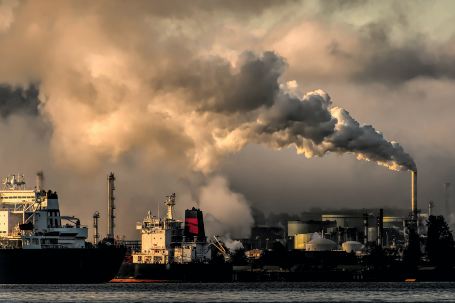 Factories with smoke and air pollution coming out of chimneys