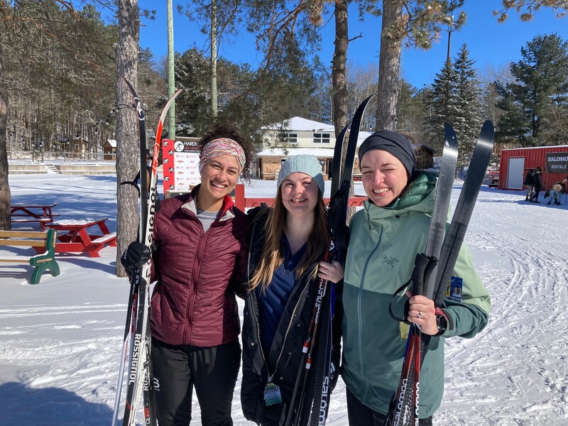 Three residents standing in the snow