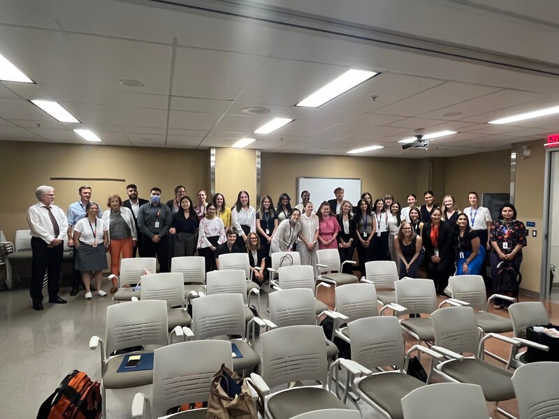 Attendees pose as a group