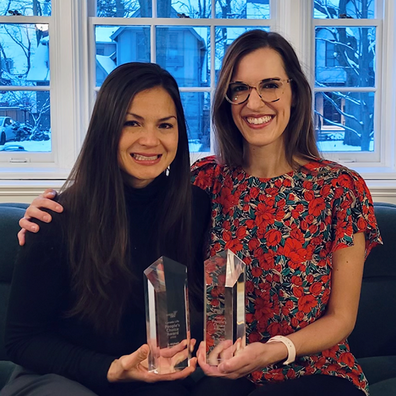 Dr. Carmen McCaffrey and Dr. Liz Miazga pose with trophies