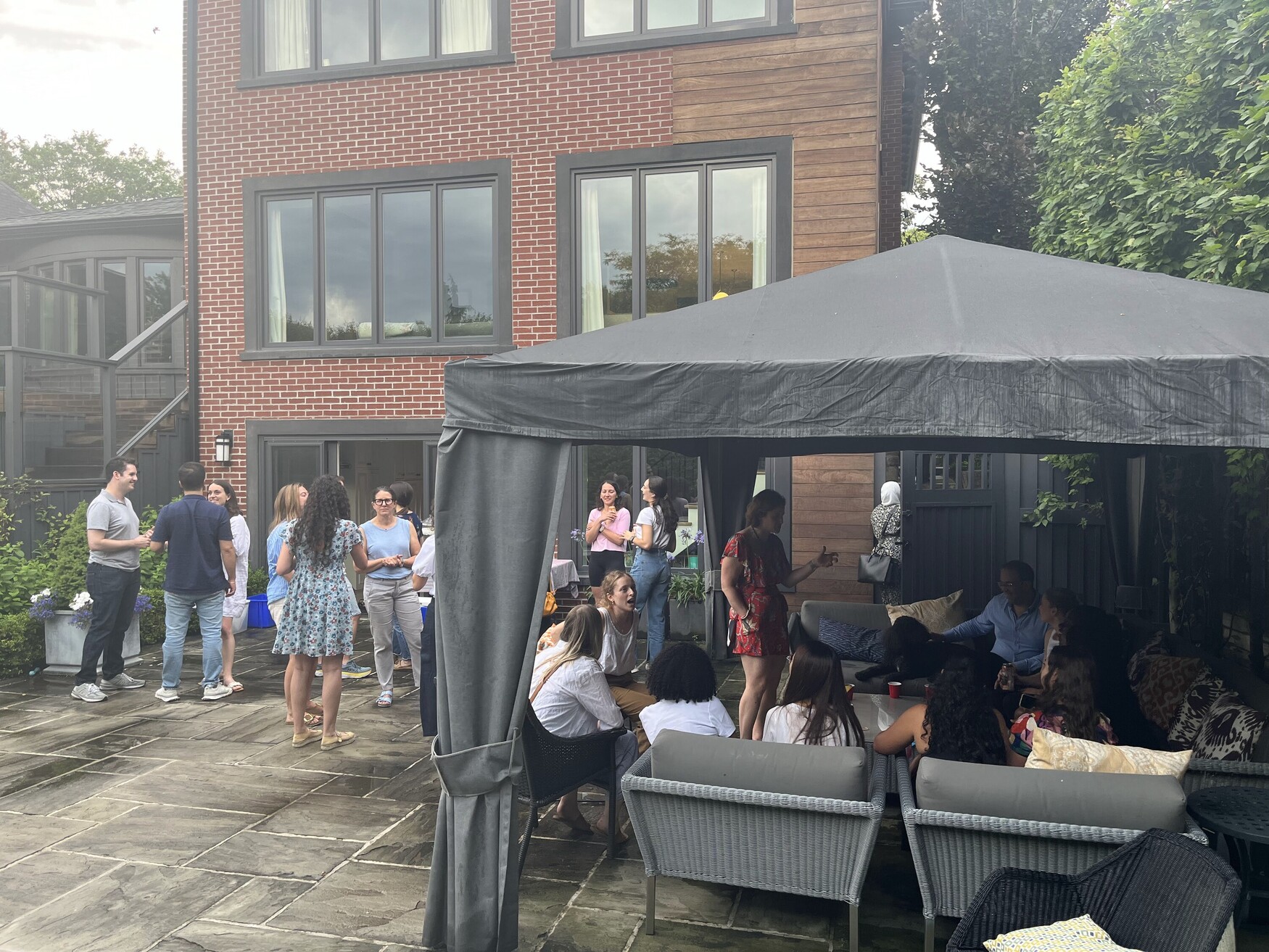 Residents gather in a tent at the Resident Barbecue