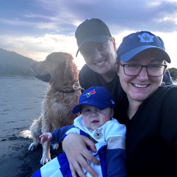 Dog and parents and child on a boat